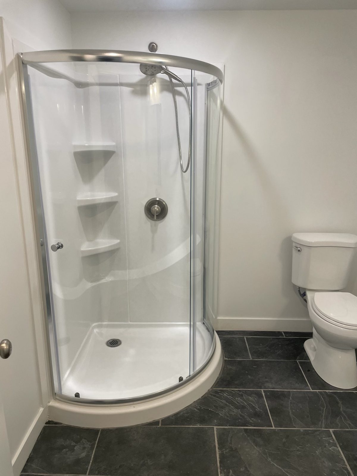 Finished basement bathroom by Firm Foundation of Utah in Lehi, UT