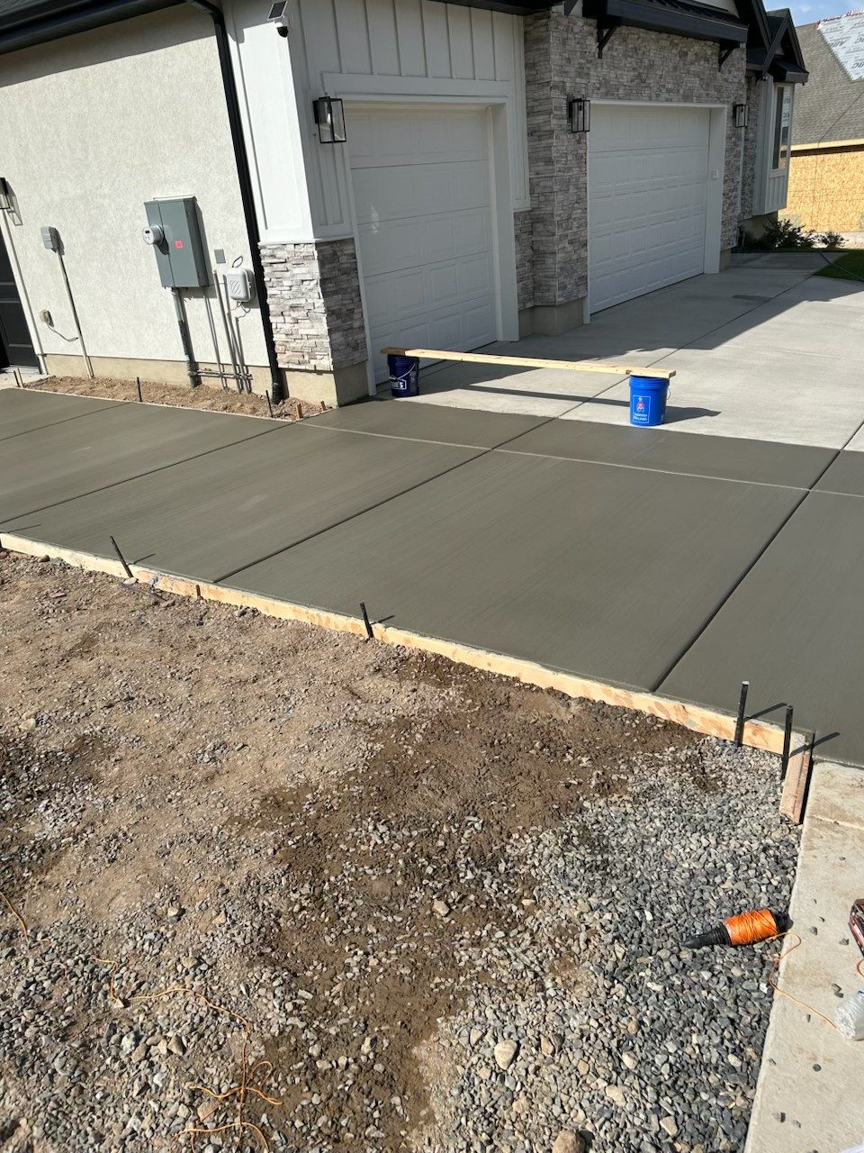 New concrete driveway poured by Firm Foundation of Utah in Lehi, UT